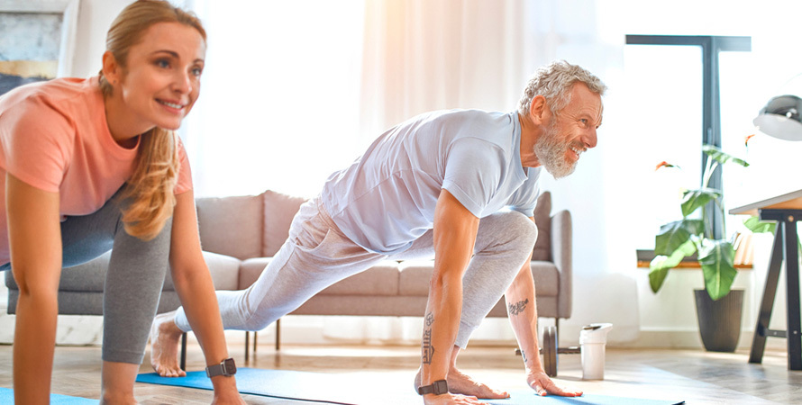 woman doing gentle low impact yoga exercise to manage joint pain and fatigue