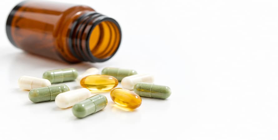 Natural Weight Loss Pills — Plant-Based Capsules and Softgels with Supplement Bottle